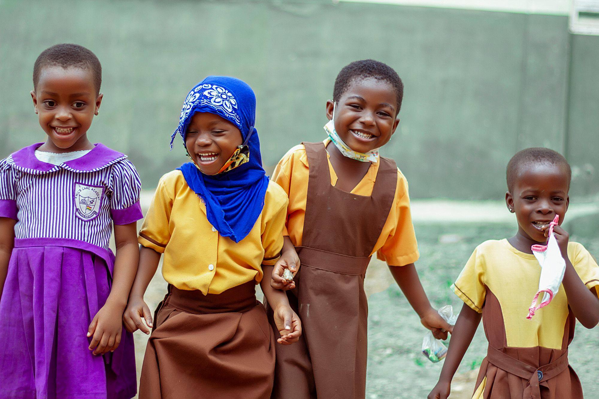 Smiling pupils in school uniforms in Accra, Ghana.
